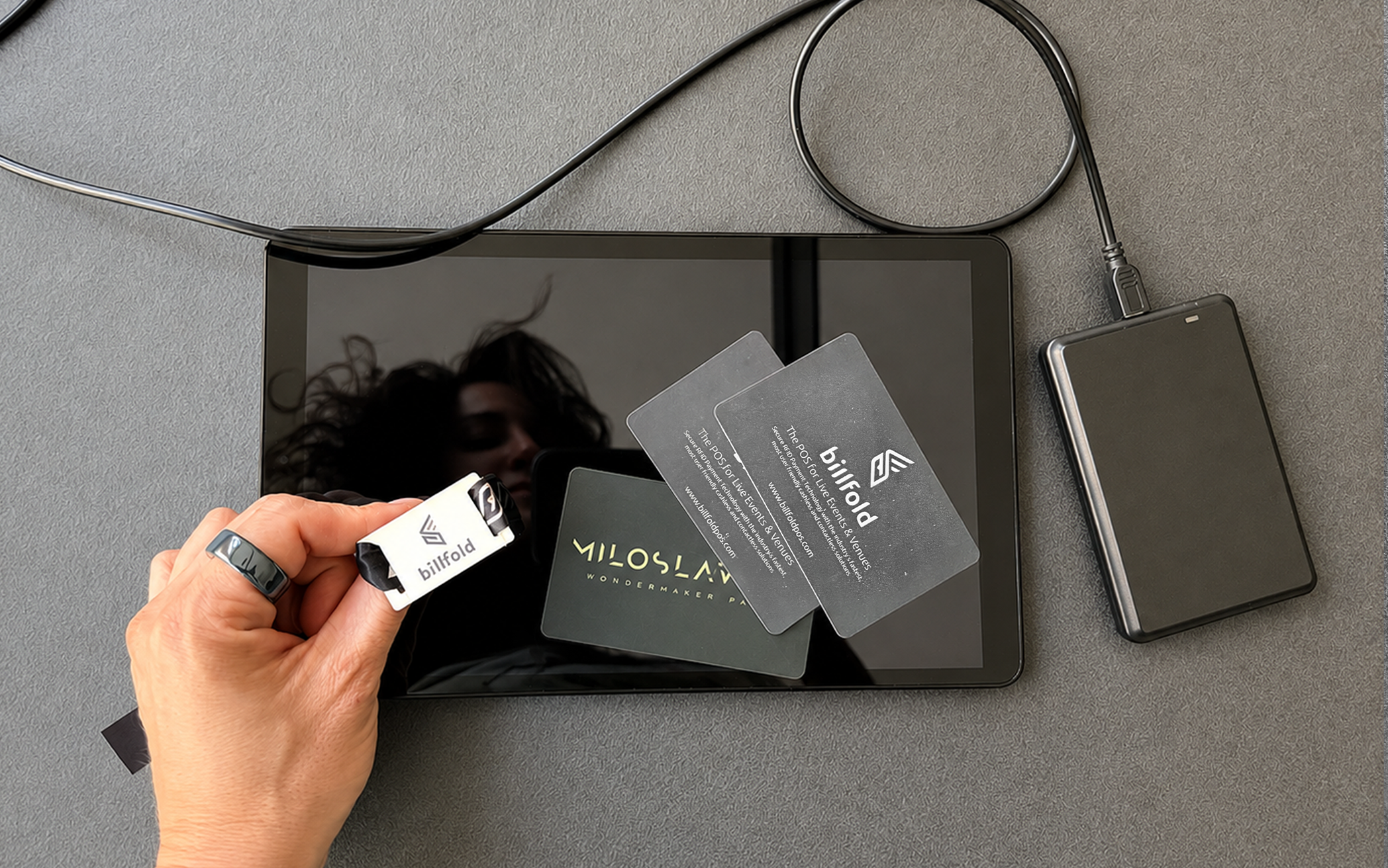 Early Billfold prototype: a tablet with an attached RFID reader on a desk